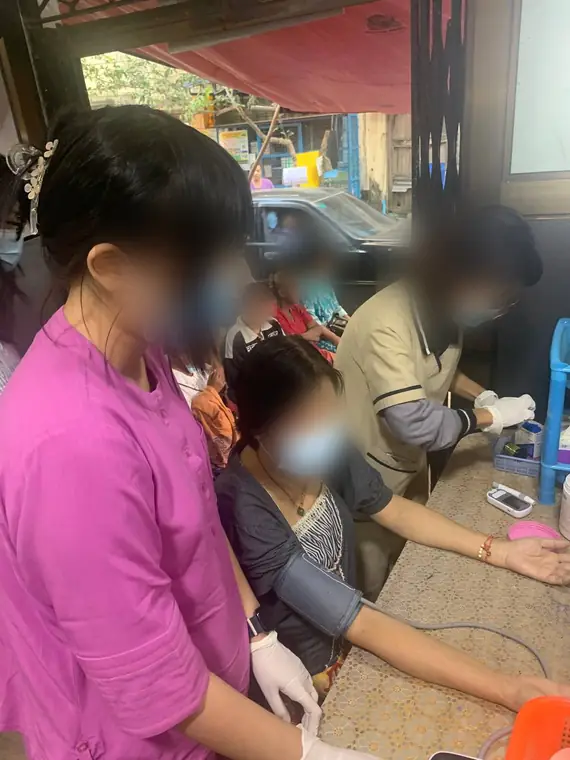 VAI student volunteers, blood pressure screening at a community clinic, Yangon