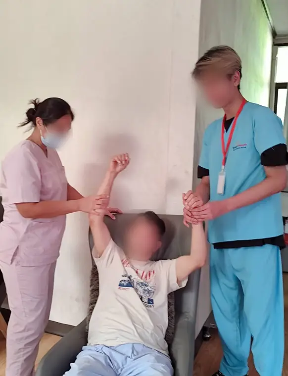 VAI student volunteers, stretching and range-of-motion exercises, Bangkok