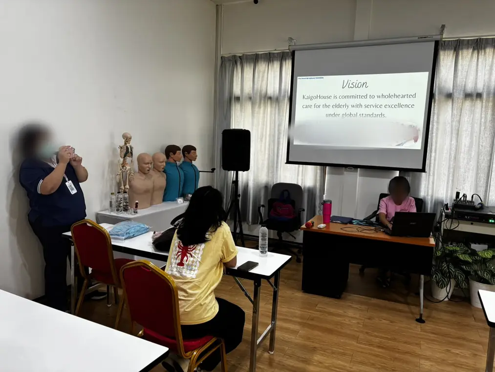 VAI student volunteers, caregiver training session, Bangkok