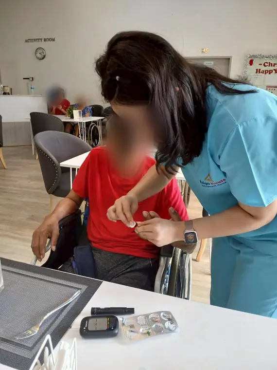 VAI student volunteers, finger-prick glucose check, Bangkok